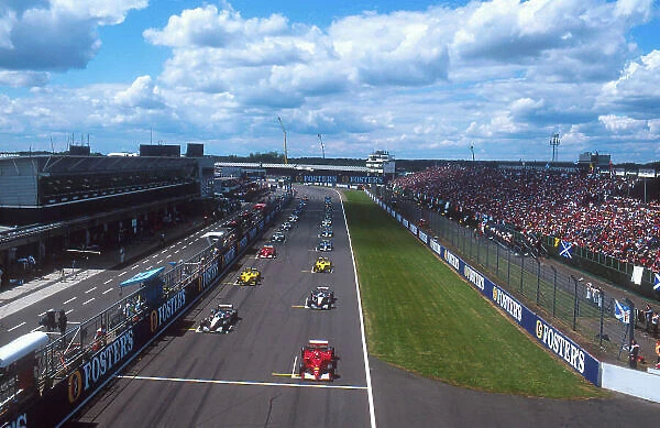 2001 British Grand Prix. Silverstone, England. 13-15 July 2001. Michael Schumacher (Ferrari F2001) on pole, with Mika Hakkinen, David Coulthard (both McLaren MP4 / 16 Mercedes), Jarno Trulli