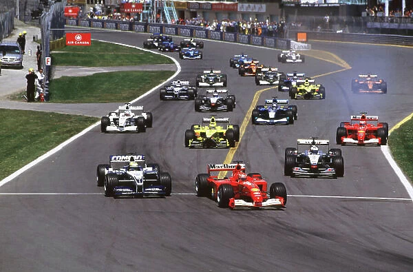 2001 Canadian Grand Prix Montreal, Canada. 8th-10th June 2001 Michael Schumacher, Ferrari F2001, leads brother Ralf Schumacher, BMW Williams FW23, and David Coulthard, West McLaren Mercedes MP4 / 16