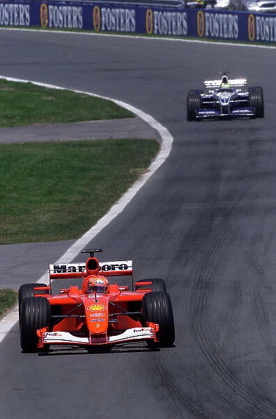 2001 Canadian Grand Prix - Race Montreal, Canada. 10th June 2001. Michael Schumacher, Ferrari F2001, leads brother Ralf Schumacher, BMW Williams FW23, action. World Copyright: Steve Etherington / LAT Photographic. ref: 18mb Digital Image Only