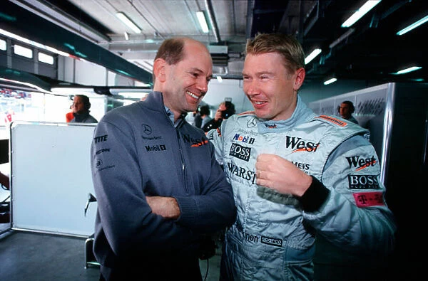 2001 European Grand Prix Adrian Newey talks with Mika Hakkinen, McLaren Nurburgring
