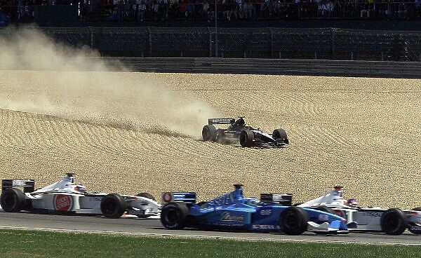 2001 European Grand Prix - Race. Nurburgring, Germany. 24th June 2001. Tarso Marques, European Minardi PS01, runs wide into the gravel at thestart of the race. World Copyright: Steve Etherington / LAT Photographic ref: 13mb Digital Image Only