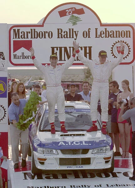 2001 FIA Middle East Rally Championship. Marlboro Rally of Lebanon, Beirut, June 29 - July 1, 2001. Pierro Liatti and Carlo Cassina celebrate on the podium. Photo: Ralph Hardwick