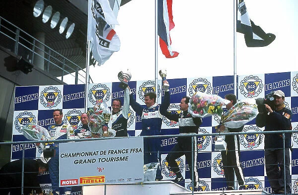 2001 French GT Championship Le Mans, France. 25th March 2001. Race 2 winners, Soulan and Goueslard - podium. World Copyright: DPPI  /  LAT Photographic ref: 13mb Digital Image