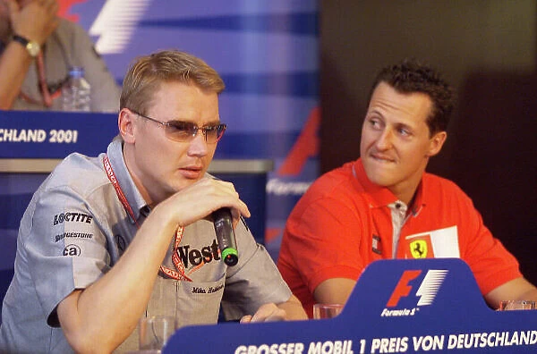 2001 German Grand Prix Hockenheim, Germany. 26th July 2001. Thursday Press Conference. Mika Hakkinen, West McLaren Mercedes MP4 / 16, and Michael Schumacher, Ferrari F2001