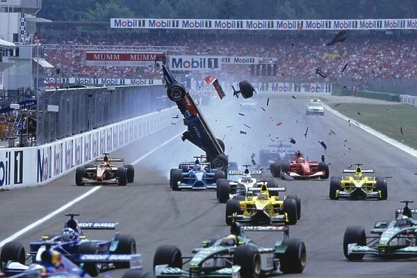 2001 German Grand Prix: Luciano Burti flies through the air after he launched off of the back of Michael Schumachers unsighted Ferrari F2001which