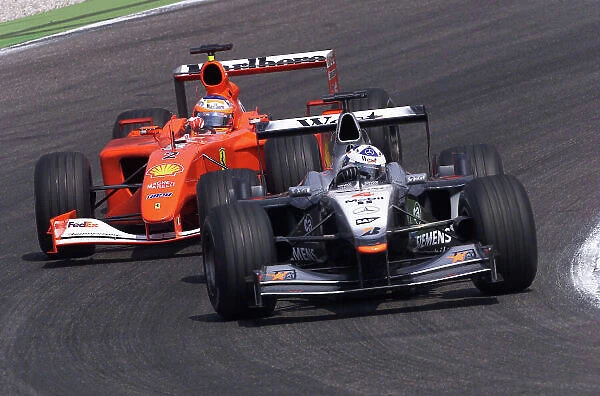 2001 German Grand Prix - Race. Hockenheim, Germany. 29th July 2001. David Coulthard, West McLaren Mercedes MP4 / 16, leads Rubens Barrichello, Ferrari F2001, action. World Copyright: Steve Etherington / LAT Photographic. ref: 17.5mb Digital Image