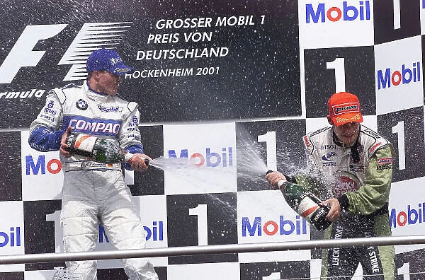 2001 German Grand Prix - Race. Hockenheim, Germany. 29th July 2001. Ralf Schumacher, BMW Williams FW23 (1st), and Jacques Villeneuve, BAR Honda BAR003 (3rd). Race podium. World Copyright: Steve Etherington / LAT Photographic. ref: 17.5mb Digital Image