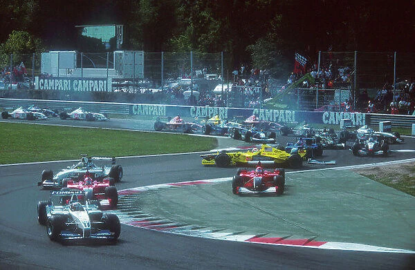 2001 Italian Grand Prix. Monza, Italy. 14-16 September 2001. Poleman Juan-Pablo Montoya (Williams FW23 BMW) leads Rubens Barrichello (Ferrari F2001) and Ralf Schumacher (Williams FW23 BMW) as Michael Schumacher (Ferrari F2001)