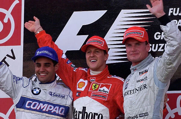 2001 Japanese Grand Prix - Sunday  /  Race Suzuka, Japan. 14th October 2001 Race podium, Michael Schumacher, Ferrari F2001, 1st, Juan Pablo Montoya, BMW Williams FW23, 2nd and David Coulthard, West McLaren Mercedes MP4 / 16