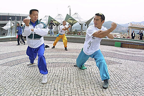 2001 Macau Grand Prix. Winners of the Martial Arts Tournament. Takuma Sato, practices with Martial Arts Master. Circuit de Guia, Macau. 14th November 2001. World Copyright: Spinney / LAT Photographic. Ref. :8. 5mb Digital Image