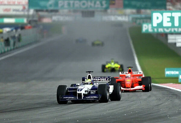 2001 Malaysian Grand Prix- Race. Sepang, Kuala Lumpur, Malaysia. 16th - 18th March 2001. Ralf Schumacher, BMW Williams leads Rubens Barrichello, Ferrari. World Copyright: Steve Etherington  /  LAT Photographic. ref: 18mb Digital Image