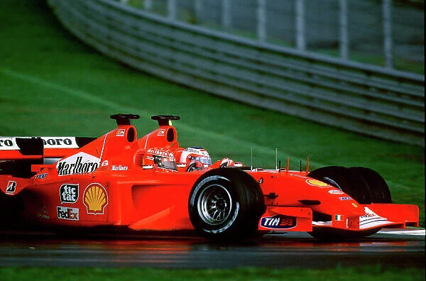 2001 Malaysian Grand Prix Sepang, Kuala Lumpur, Malaysia. 16th - 18th March 2001 Michael Schumacher, Ferrari, passes team mate Rubens Barrichello. World Copyright: Clive Rose / LAT Photographic ref:35mm Image A09