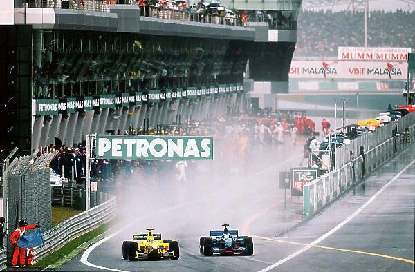 2001 Malaysian Grand Prix Sepang, Kuala Lumpur, Malaysia. 16th - 18th March 2001 Heinz-Harald Frentzen, Jordan Honda and Jean Alesi, Prost Acer exit the pits. World Copyright: Charles Coates / LAT Photographic ref:35mm Image A07