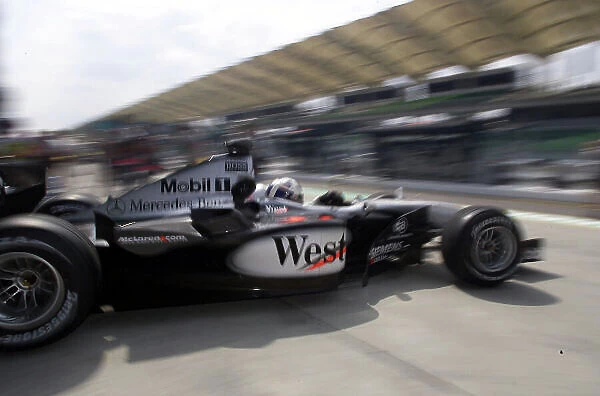 2001 Malaysian Grand Prix Sepang, Kuala Lumpur, malaysia. 16th - 18th March 2001. David Coulthard, McLaren Mercedes, exits the pits during Friday practice. World Copyright: Etherington  /  LAT Photographic ref: 18mb digital image