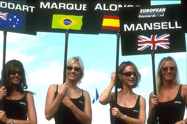 2001 Minardi F1 Two Seater Race. Donington, England. 21st August 2001. Grid girls for the 4 drivers, Stoddarrt, Marques, Alonso and Mansell, for the worlds first ever 2 seater race