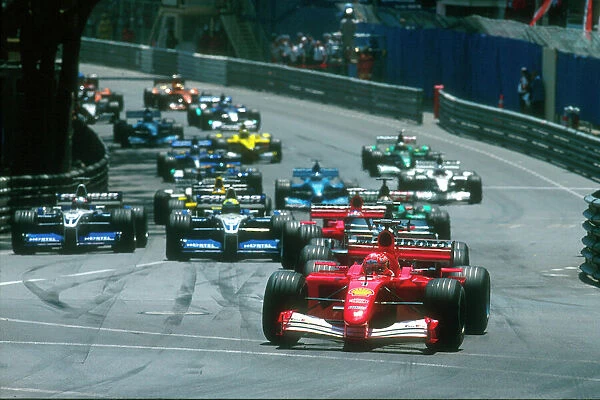 2001 Monaco Grand Prix: Michael Schumacher, Ferrari F2001, makes the best start from the grid into Ste Devote