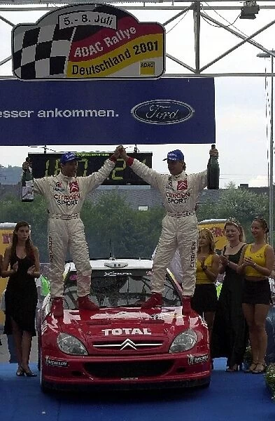 2001 Rally Deutschland: Philippe Bugalski and Jean-Paul Chiaroni celebrate victory