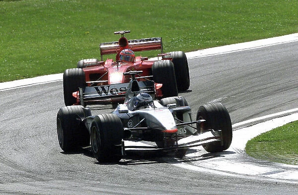 2001 San Marino Grand Prix - Race Imola, Italy. 15th April 2001. Mika Hakkinen, West McLaren Mercedes leads Rubens Barrichello, Ferrari - action. World Copyright: Steve Etherington / LAT Photographic ref: 17.5 mb digital image