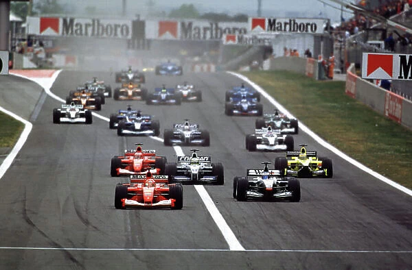 2001 Spanish Grand Prix Barcelona, Spain. 27th - 29th April 2001. Start shot where Michael Schumacher takes the lead World Copyright: LAT Photographic ref: 35mm Image