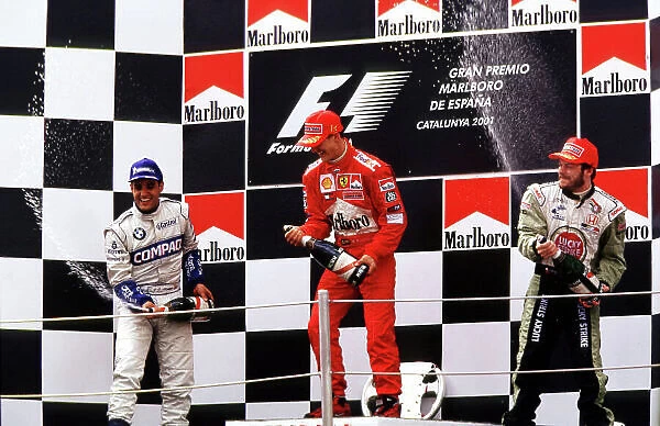 2001 Spanish Grand Prix Barcelona, Spain. 27th - 29th April 2001. Schumacher Montoya and Villeneuve spray chmpagne from the podium World Copyright: LAT Photographic ref: 35mm Image