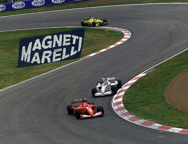 2001 Spanish Grand Prix - Race. Barcelona, Spain. 29th April 2001. Jacques Villeneuve, BAR Honda BAR003, and Jarno Trulli, Jordan Honda EJ11, get ready to unlap themselves from the slowing Ferrari of Michael Schumacher