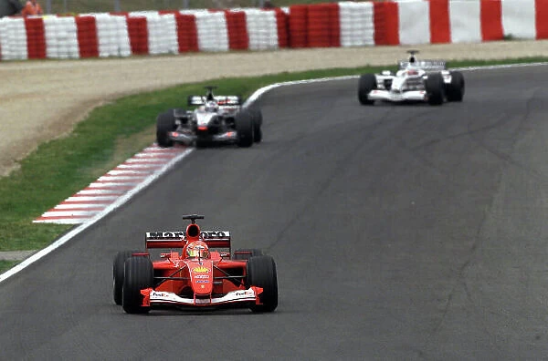 2001 Spanish Grand Prix - Race. Barcelona, Spain. 29th April 2001. Michael Schumacher, Ferrari F2001, leads David Coulthard, West McLaren Mercedes MP4 / 16 and Olivier Panis, BAR Honda BAR003