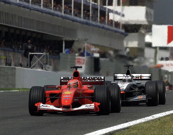 2001 Spanish Grand Prix - Race. Barcelona, Spain. 29th April 2001. David Coulthard, West McLaren Mercedes MP4 / 16 comes up to the back of Michael Schumacher, Ferrari F2001