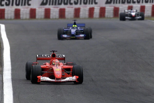 2001 Spanish Grand Prix - Race. Barcelona, Spain. 29th April 2001. Michael Schumacher, Ferrari F2001, is followed by Luciano Burti, Prost Acer AP04, and 2nd placed Mika Hakkinen, West McLaren Mercedes MP4 / 16