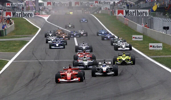 2001 Spanish Grand Prix - Race. Barcelona, Spain. 29th April 2001. Michael Schumacher, Ferrari F2001, leads Mika Hakkinen, West McLaren Mercedes MP4 / 16, Ralf Schumacher, BMW Williams FW23, Rubens Barrichello, Ferrari F2001, and Jarno Trulli