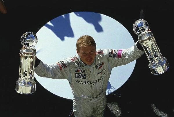 2001 United States Grand Prix. Indianapolis, Indiana, USA. 28-30 September 2001. Mika Hakkinen (McLaren Mercedes) celebrates his 1st position on the podium. Ref-01 USA 23. A Race Through Time exhibition number 25. World Copyright - Clive Rose / LAT