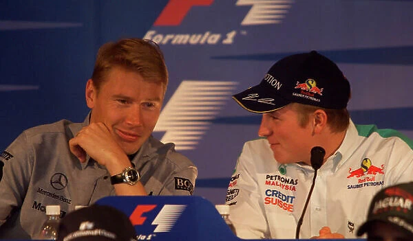 2001 United States Grand Prix Indianapolis, United States. 27th September 2001. Mika Hakkinen, West McLaren Mercedes MP4 / 16, talks wityh Kimi Raikkonen, Sauber Petronas C20