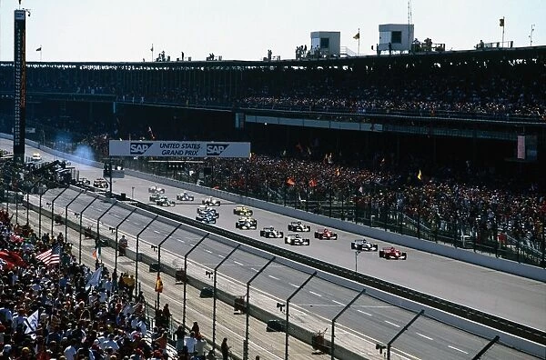 2001 United States Grand Prix: Michael Schumacher leads the field away at the start, followed by Juan-Pablo Montoya, Ralf Schumacher, Rubens Barrichello