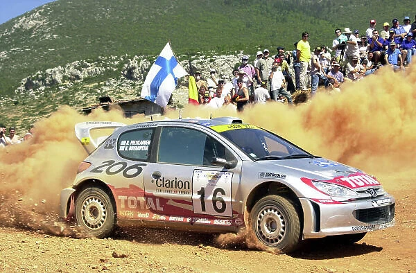 2001 World Rally Championship. Acropolis Rally June 14-17, 2001. The sole surviiving works Peugeot at the end of leg 1 was Harri Rovenpera seen here on stage 1. Photo: Ralph Hardwick / LAT