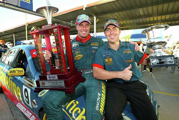 2002 Australian V8 Supercar Championship R9 QLD 500 Queensland, Australia.15th September 2002 Ford driver David Besnard and C0 driver Simon Wills on the podium after winning the QLD 500