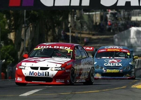 2002 Australian V8 Supercars Adelaide Clipsal 500. Australia. 17th March 2002. Holden Racing Team's Mark Skaife and Caltex Havoline driver David Besnard on the streets of Adelaide during the opening laps of the race one. World Copyright