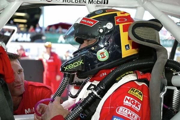 2002 Australian V8 Supercars Adelaide Clipsal 500. Australia. 17th March 2002 Holden driver Mark Skaife sits in his car befor the start of race 2 with a new airconditioned helmet system the team tried for the first time this weekend. World Copyright
