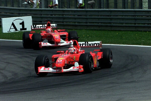 2002 Austrian Grand Prix A1-Ring, Austria, 10th-12th May 2002 Rubens Barrichello, Ferrari F2002, leads Michael Schumacher, Ferrari F2002, World Copyright Photo4