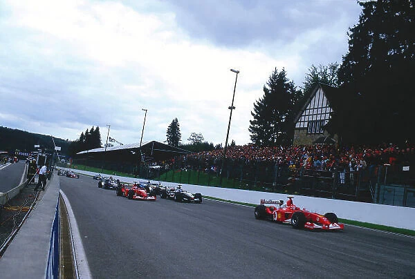2002 Belgian Grand Prix. Spa-Francorchamps, Belgium. 30 / 8-1 / 9 2002. Michael Schumacher followed by Rubens Barrichello (both Ferrari F2002's), Kimi Raikkonen (McLaren MP4 / 17 Mercedes), Ralf Schumacher