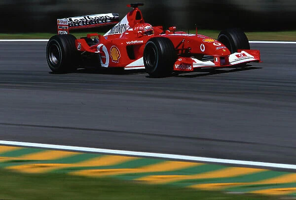 2002 Brazilian Grand Prix, Interlagos, Brazil. 29th - 31st March 2002. Michael Schumacher races the Ferrari F2002 for the first time at Interlagos. World Copyright: Bellanca /  LAT Photographic Ref: 35mm Transparency A14
