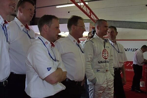 2002 British Touring Car Championship Silverstone, England. 1st-3rd June 2002 James Thompson and the Vauxhall mechanics watch the England match before qualifying. Photo: Paul Dowker / LAT Photographic World LAT PHOTOGRAPHIC 8.9MB Digital File Only