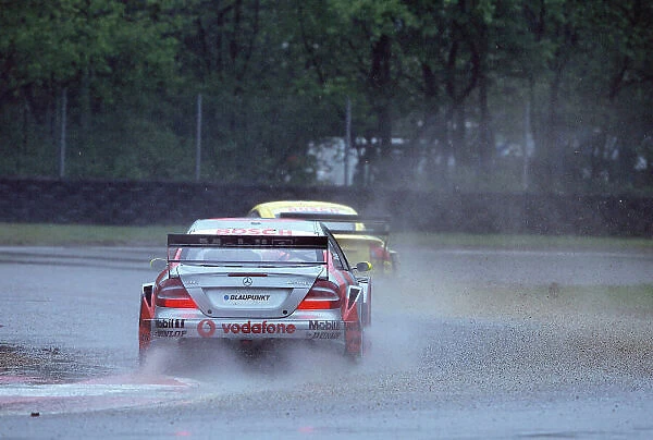 2002 DTM Championship, Zolder, Belgium. Rd 2, 4th-5th May 2002. Bernd Schneider chases the Audi of Christian Abt in the treacherous conditions of a wet Zolder track. World Copyright: Lawrence / LAT Photographic