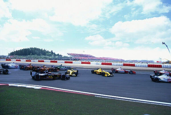 2002 European Grand Prix, Nurburgring, Germany. 23rd June 2002 The two colliding Jordans send the rest of the F1 pack in different directions as they try to take avoiding action. World Copyright: LAT Photographic Ref: 35mm transparency