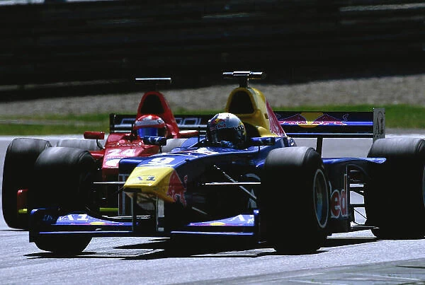 2002 F3000 Championship A1-Ring, Austria. 11th May 2002. Patrick Friessacher (Red Bull Jnr), leads Enrico Toccacelo (Coloni F3000), action. World Copyright: Clive Rose / LAT Photographic ref: 35mm Image A19