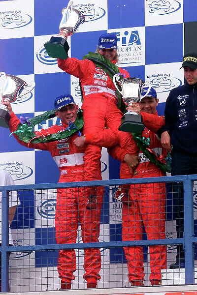 2002 FIA GT Championship Donington Park, England. 5th - 6th October 2002. Enzo Calderari / Lilian Bryner / Jean Marc Gounon (Ferrari 550 Maranello) 2nd position podium. World Copyright: Photo4 / LAT Photographic ref: Digital Image Only