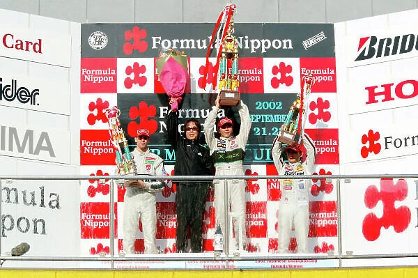 2002 Formula Nippon Championship Mine, Japan. 22nd September 2002. Race podium Satoshi Motoyama (XBOX Impul), 1st, Ralph Firman (PIAA Nakajima), 2nd and Ryo Michigami (5Zigen) 3rd. World Copyright: Yasushi Ishihara / LAT Photographic ref