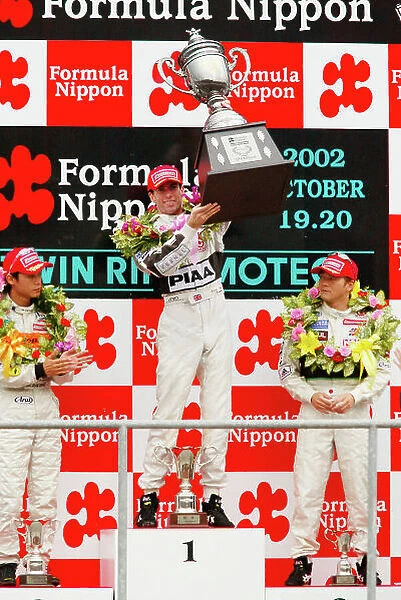 2002 Formula Nippon Championship Motegi, Japan. 20th October 2002. Race winner Ralph Firman (PIAA Nakajima), podium. Wprld Copyright: Yasushi Ishihara / LAT Photographic ref: Digital Image Only