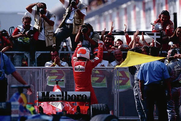 2002 Hungarian Grand Prix. Hungaroring, Hungary. 16-18 August 2002. Rubens Barrichello (Ferrari) celebrates his 1st position in parc ferme after the race. Ref-02 HUN 32. World Copyright - Tee / LAT Photographic