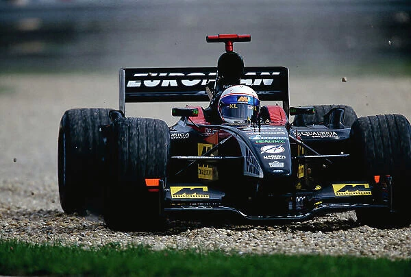 2002 Hungarian Grand Prix. Hungaroring, Hungary. 16-18 August 2002. Anthony Davidson (Minardi PS02 Asiatech) did very well on his Grand Prix debut, despite this trip through the gravel trap. Ref-02 HUN 24. World Copyright - Coates / LAT Photographic