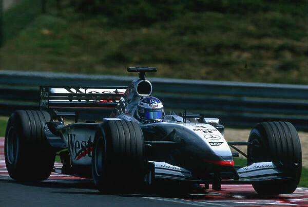 2002 Hungarian Grand Prix. Hungaroring, Hungary. 16-18 August 2002. Kimi Raikkonen (McLaren MP4 / 17 Mercedes). Ref-02 HUN 41. World Copyright - Charles Coates / LAT Photographic
