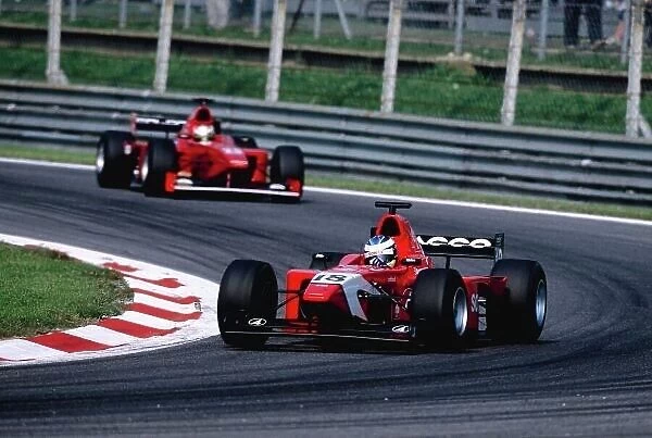 2002 International F3000 Monza, Italy. 14th September 2002 Race winner Bjorn Wirdheim (Arden) leads Giorgio Pantano (Coloni F3000), action. World Copyright: Charles Coates / LAT Photographic ref: 35mm Image A20